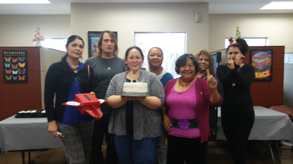 Interim's OMNI Resource Center Celebrates 10 Years 13 a group of people posing for a photo