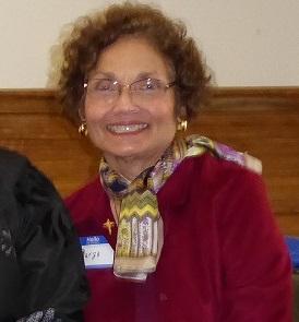 a woman wearing glasses and a scarf