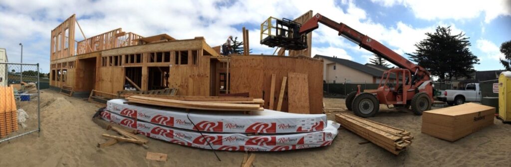 Interim Bridge House Capital Campaign Nearing Goal! 9 a construction site with a crane and a couple of people