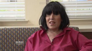 a woman sitting on a couch