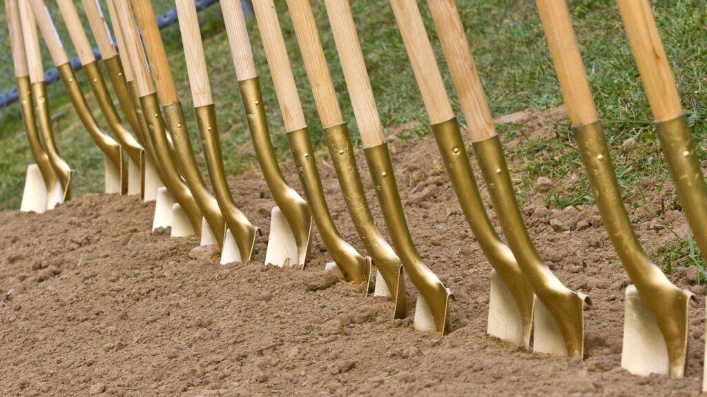 Interim to Hold Groundbreaking Ceremony for New Bridge House May 12th 1 a row of shovels in the dirt