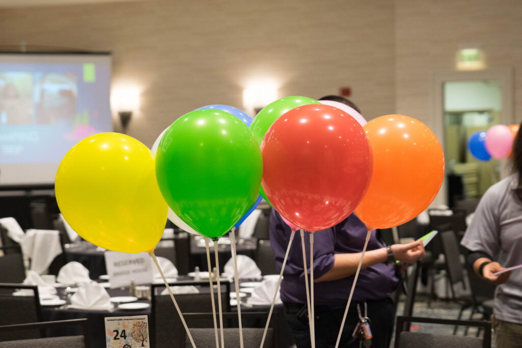 a group of balloons in a room
