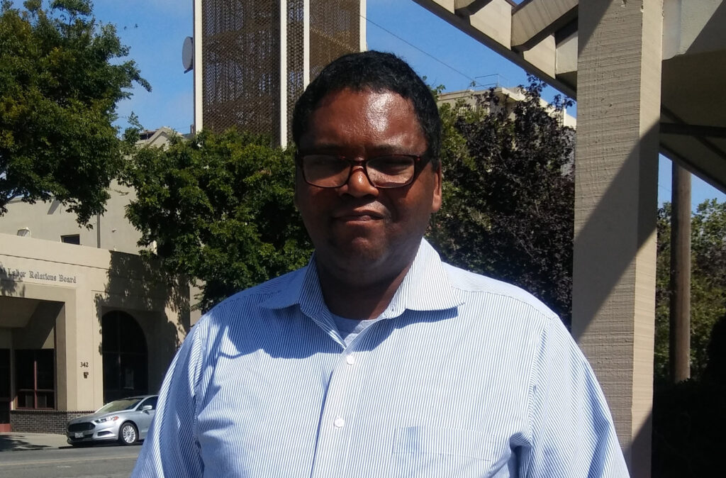 Kenneth Payne: A Proud OMNI Volunteer 10 a man in glasses standing outside
