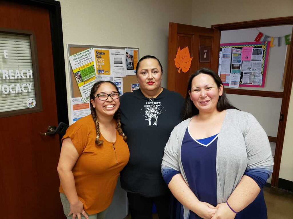 a group of women standing in a room