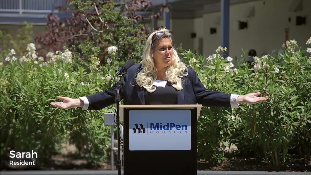 Interim's Sarah Chandler Speaks At Mid-Pen Housing's Moon Gate Plaza Grand Opening 1 SarahMoonGatestill