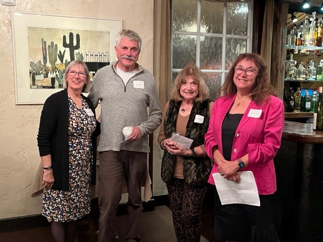 A Legacy of Service - Two Longtime Board Members Retiring 16 a group of people standing in a room