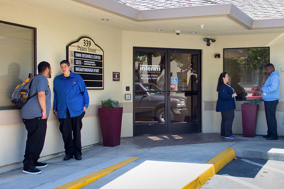 a group of people standing outside of a building