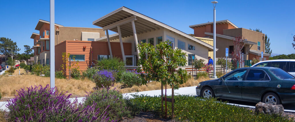 a building with a roof and a car parked in front of it