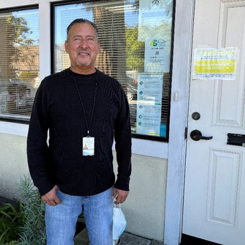 a man standing outside a door