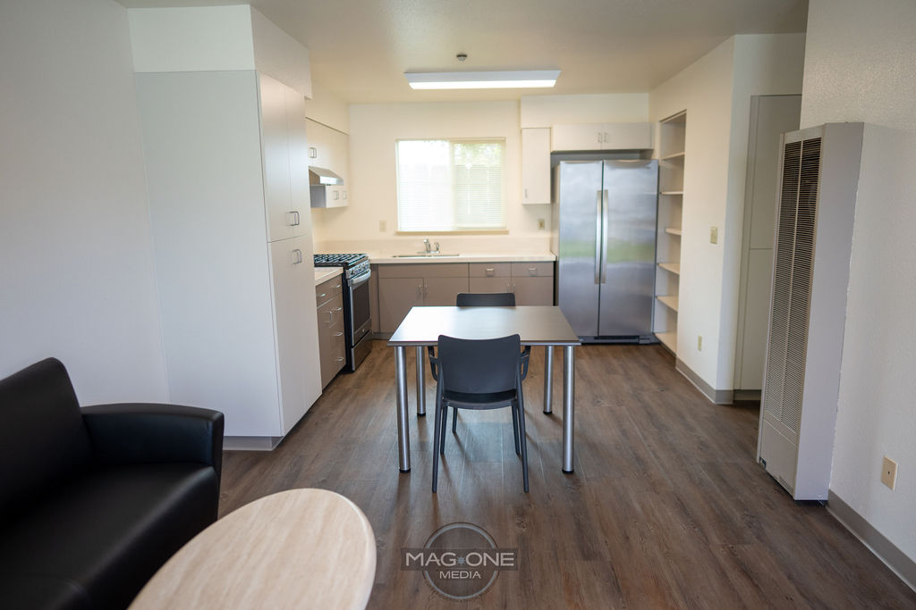 a kitchen with a table and chairs