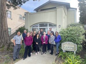 a group of people standing in front of a building