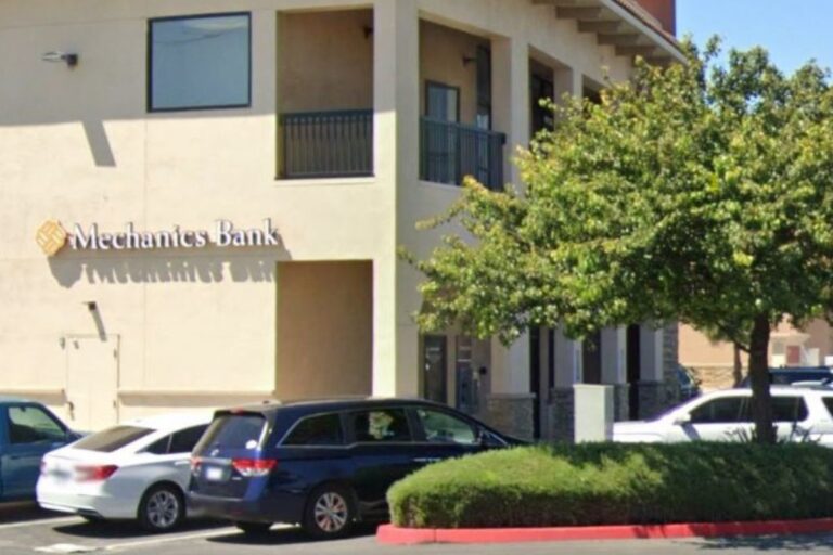a building with cars parked in front of it