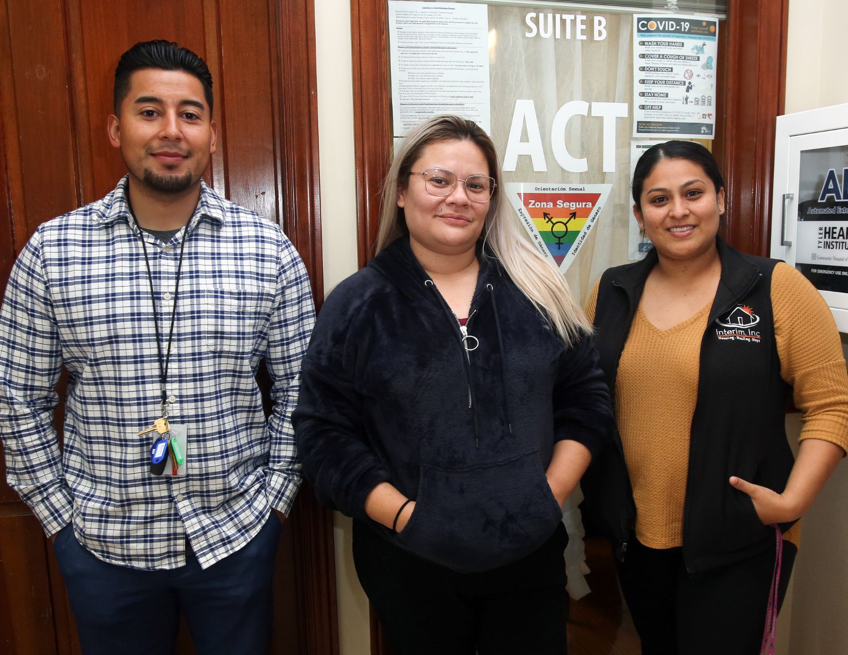 a group of people standing in front of a door