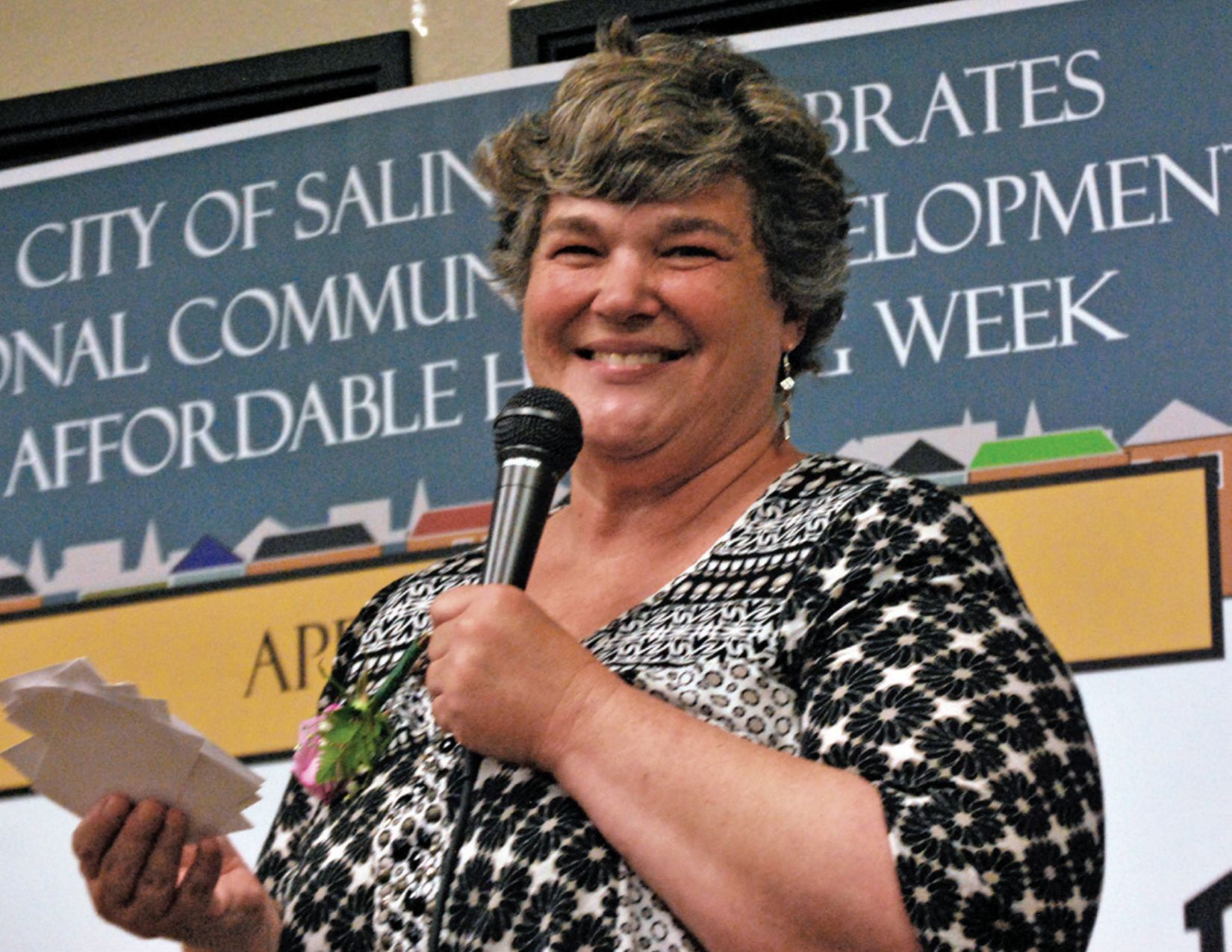 a woman holding a microphone