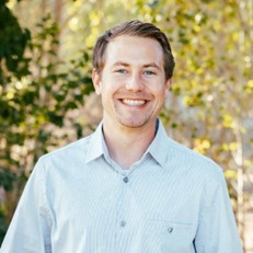 a man smiling for a picture