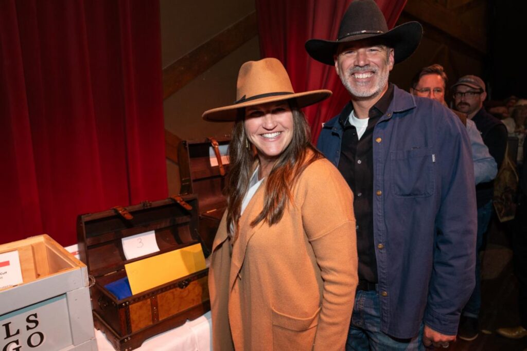 a man and woman standing next to each other