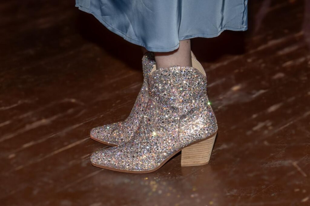 a pair of boots with glitter on them