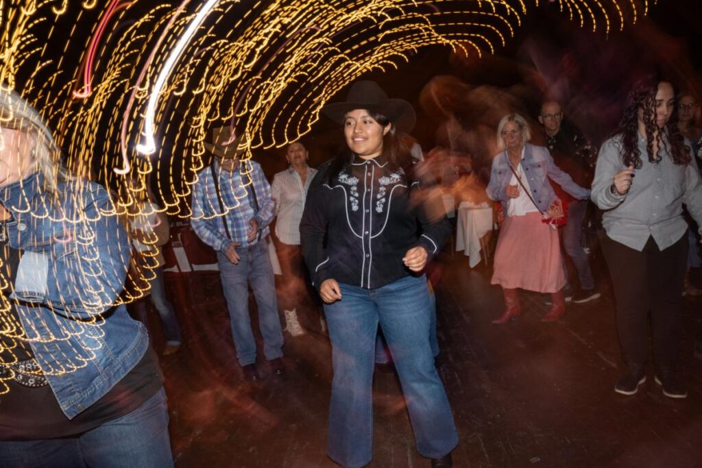 a woman dancing in a crowd