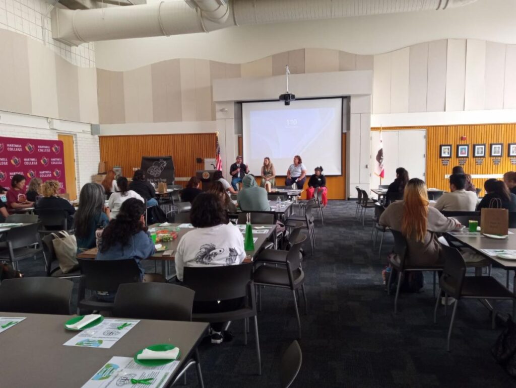 SOS Celebrates World Mental Health Day 25 a group of people in a room with a projector screen