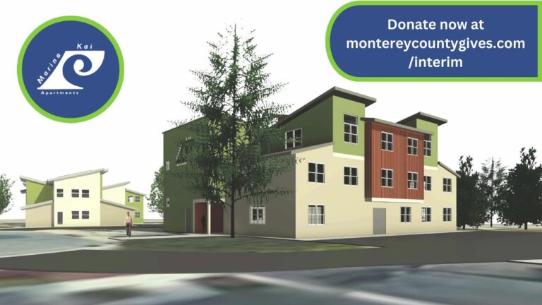 a group of houses with trees and a sign