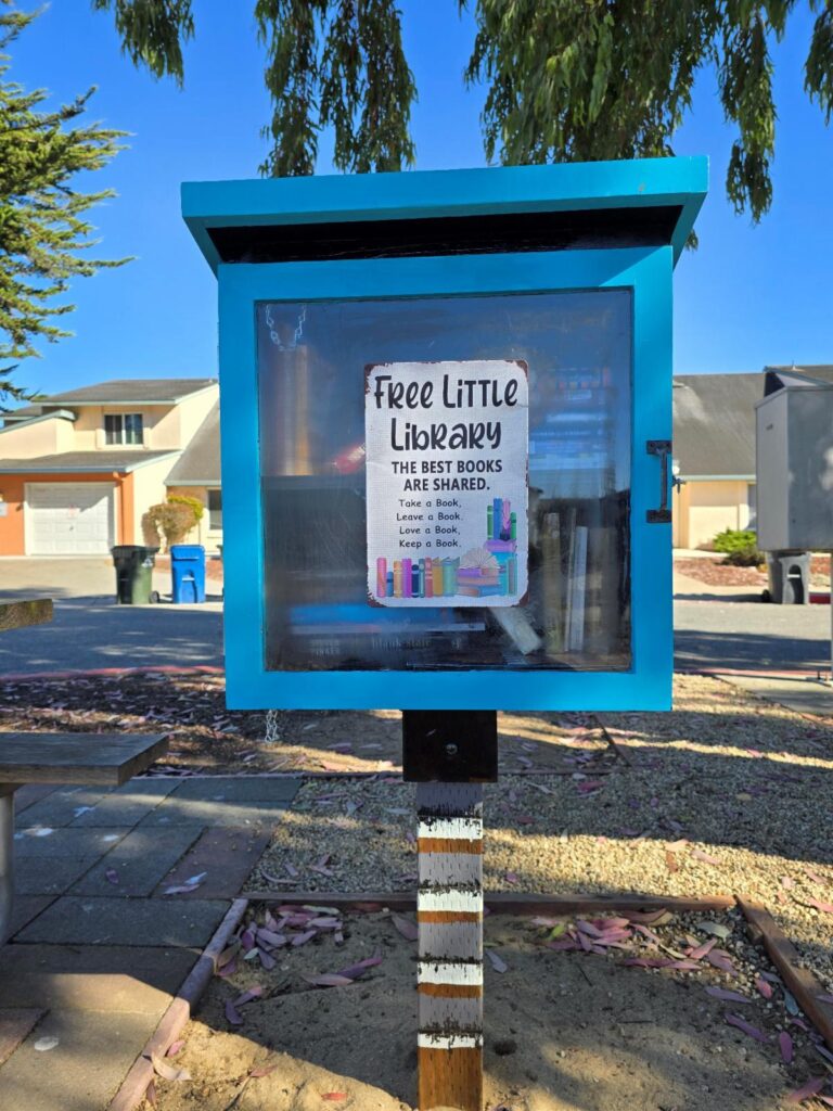a blue box with a sign on it