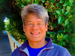 a man smiling at camera