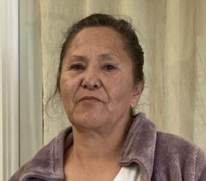 a woman in a purple jacket