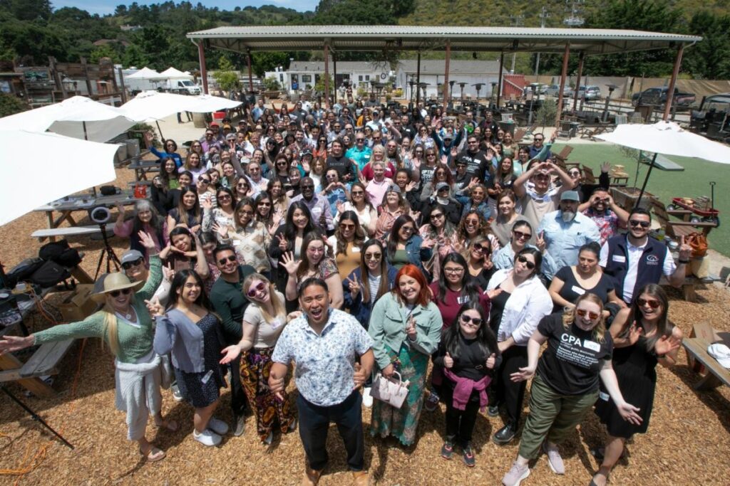 a large group of people posing for a photo