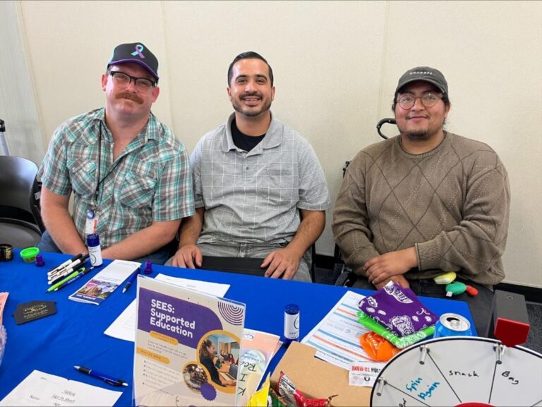 a group of men sitting at a table