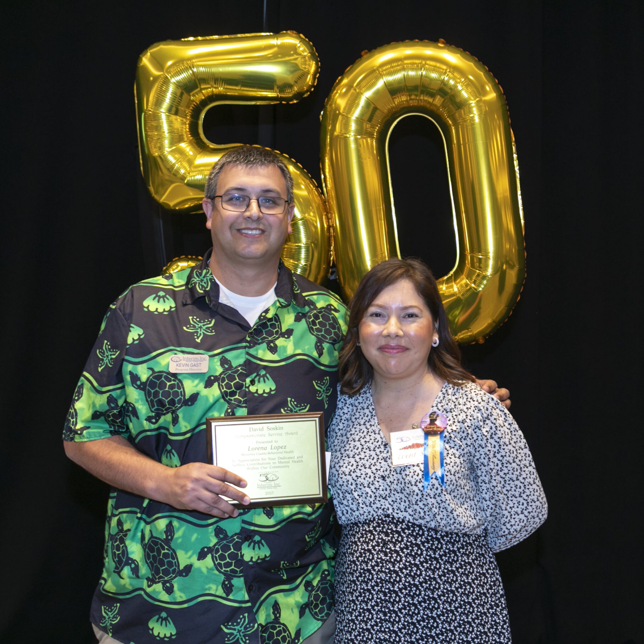 a man and woman posing for a photo