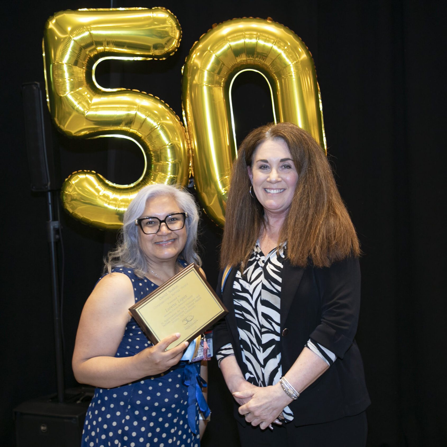 two women standing next to each other