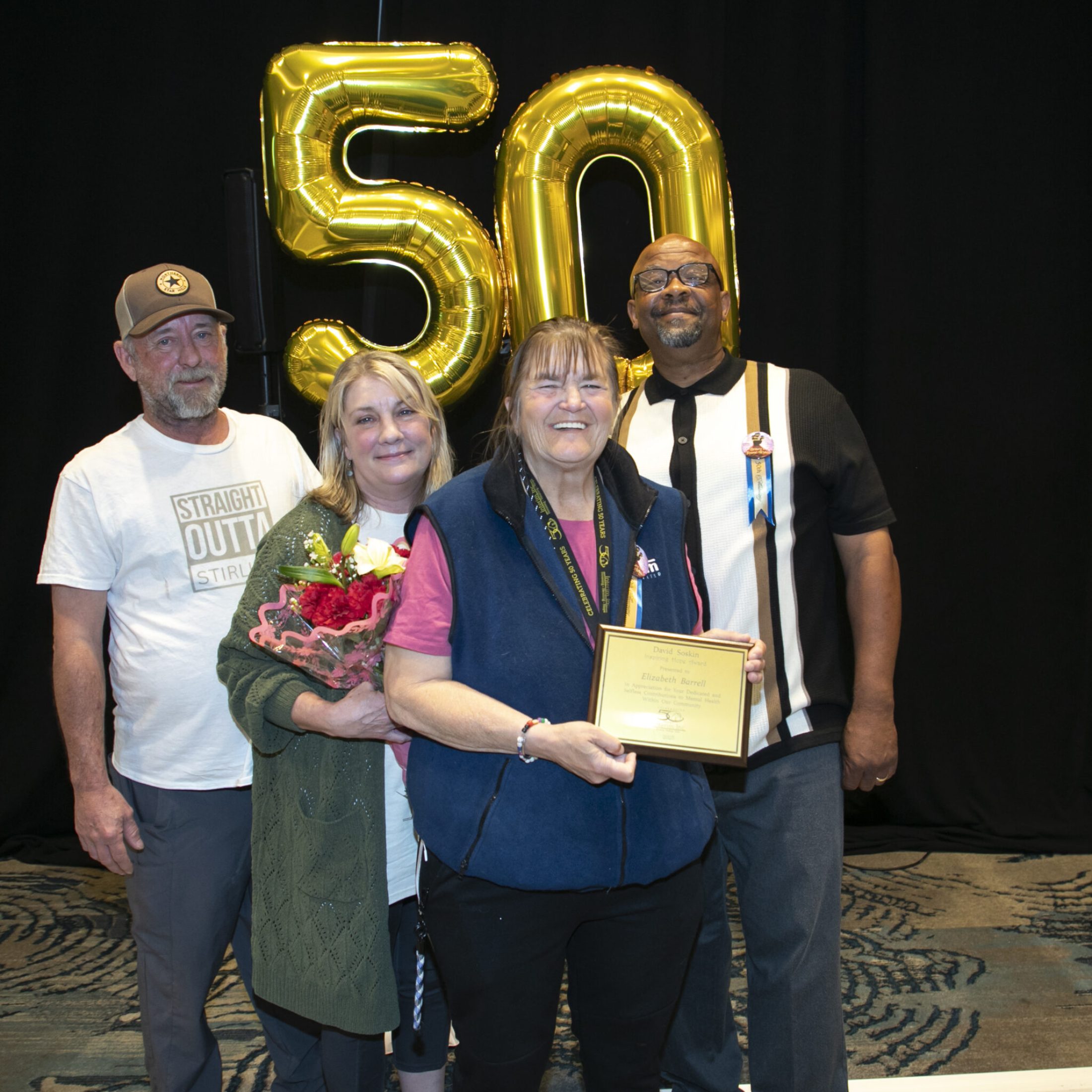 a group of people posing for a photo